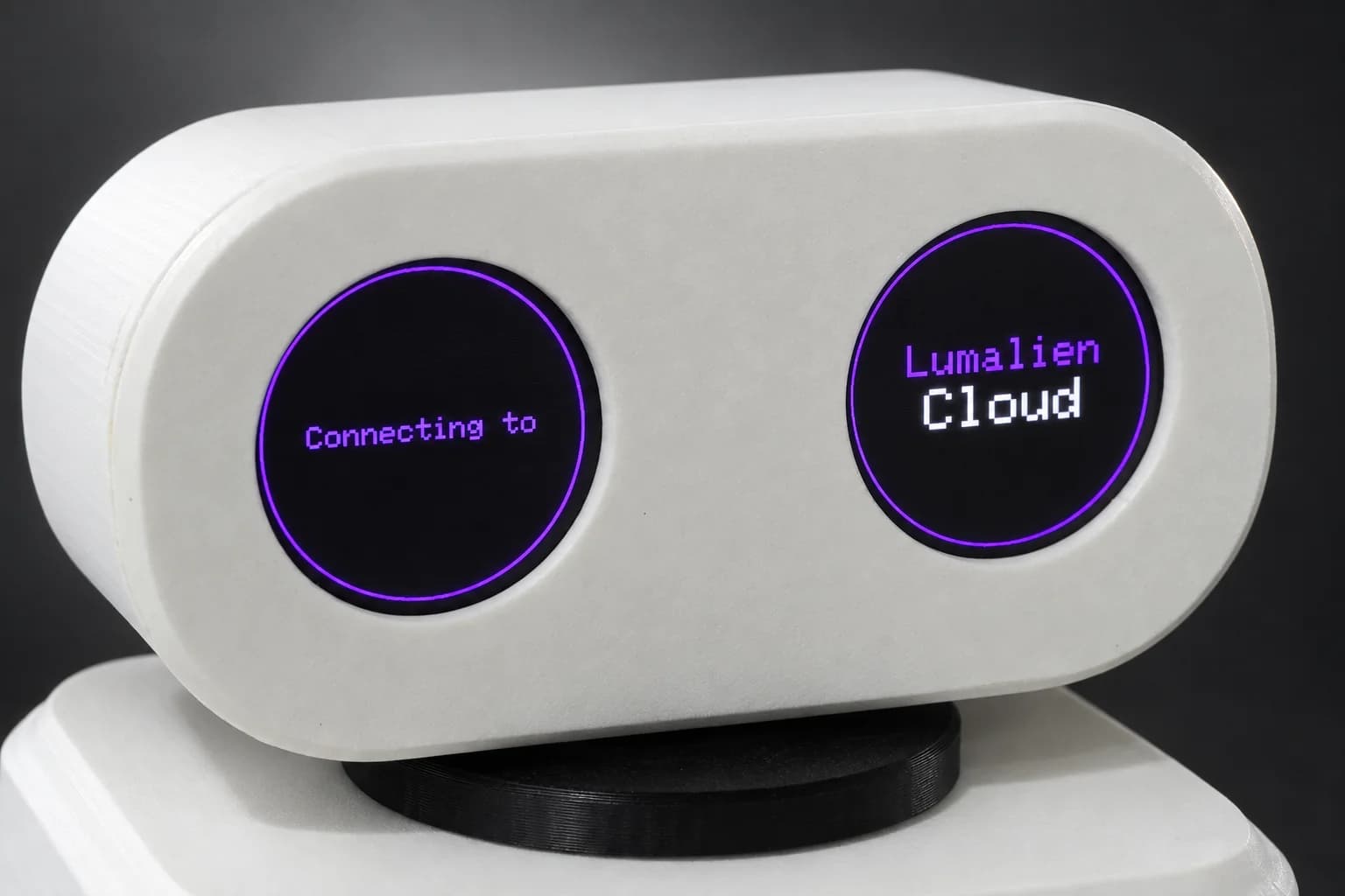 Close-up of the AELX-2 head, the left eye reading Connecting to and the right eye reading Lumalien Cloud