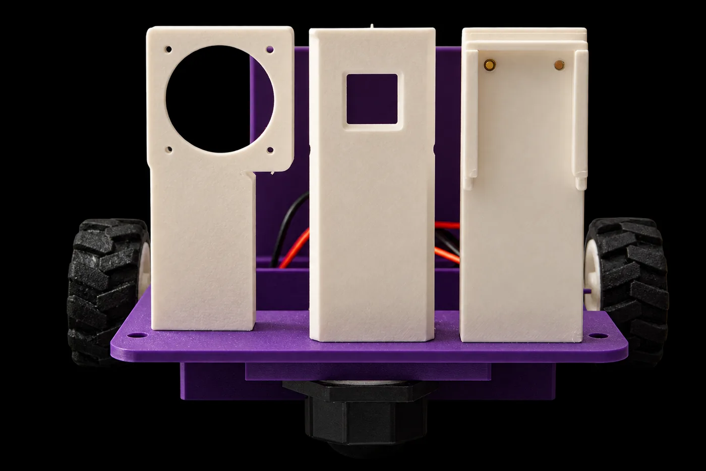 The three printed mounts standing on the chassis: the fan mount, the distance sensor mount, and the NoIR camera mount