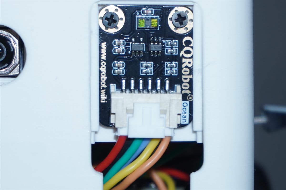 Close-up of the time-of-flight distance sensor board mounted through the front of the shell