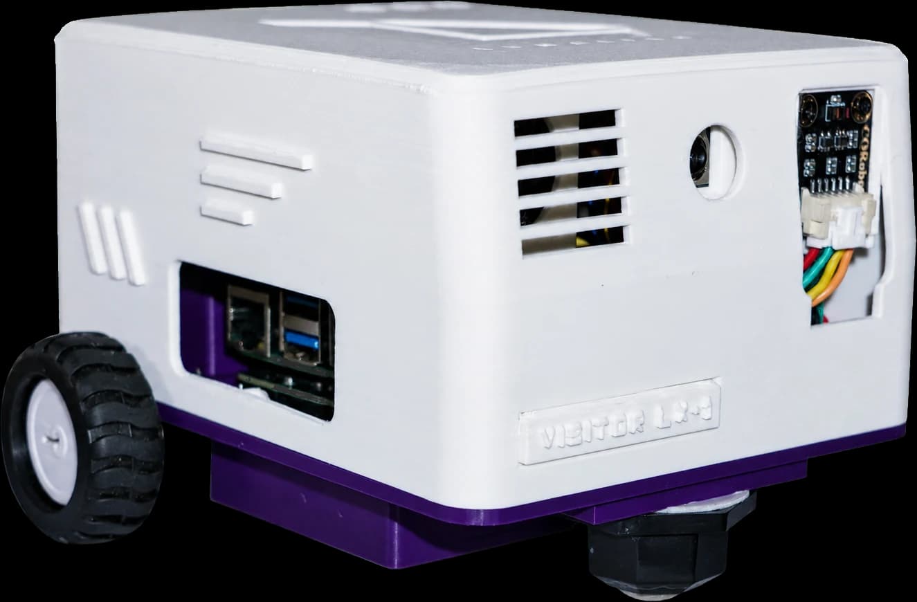 The side of VISITOR LX-1, with the Raspberry Pi's USB and Ethernet ports exposed above the purple chassis